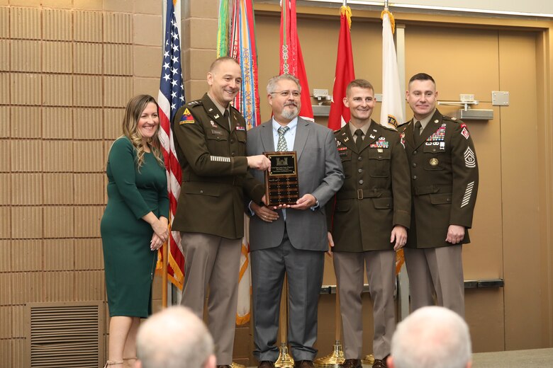 Laurence “Larry” Orr (middle), Honolulu District Small Business Professional, and Lt. Col. Adrian Biggerstaff (second from the right), Honolulu District Commander, receive an award from Lieutenant General William H. Graham (second from the left), 56th Chief of Engineers and Commanding General, U.S. Army Corps of Engineers and Command Sergeant Major Douglas Galick (far right), 15th Command Sergeant Major, and Elizabeth “Liz” Walker, Director of Small Business, U.S. Army Corps of Engineers (left) during a contracting and small business partnerships awards ceremony on Nov. 20 at the Ernest N. Morial Convention center in New Orleans, Louisiana.