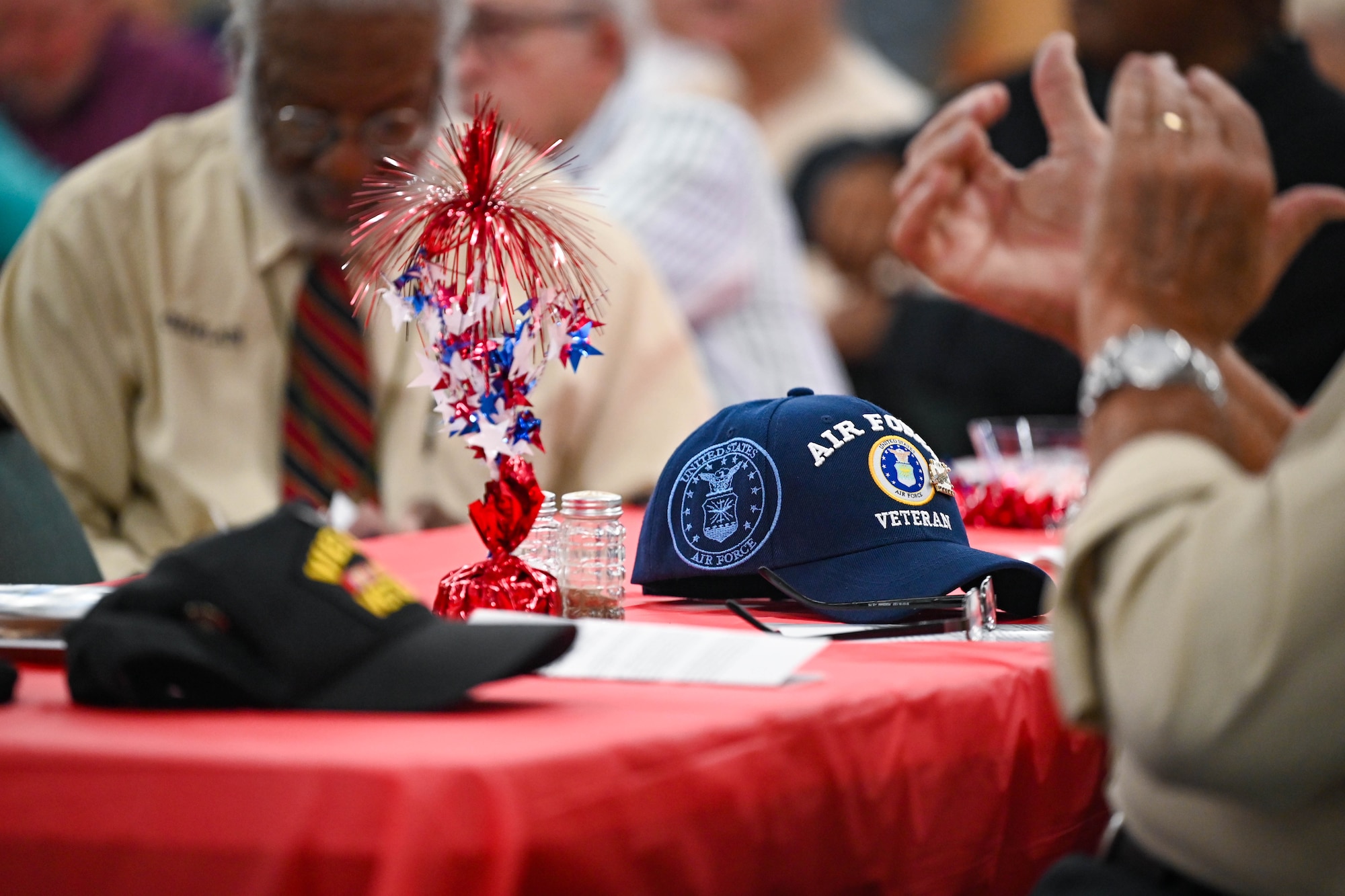 A veterans hat is rested on a table.