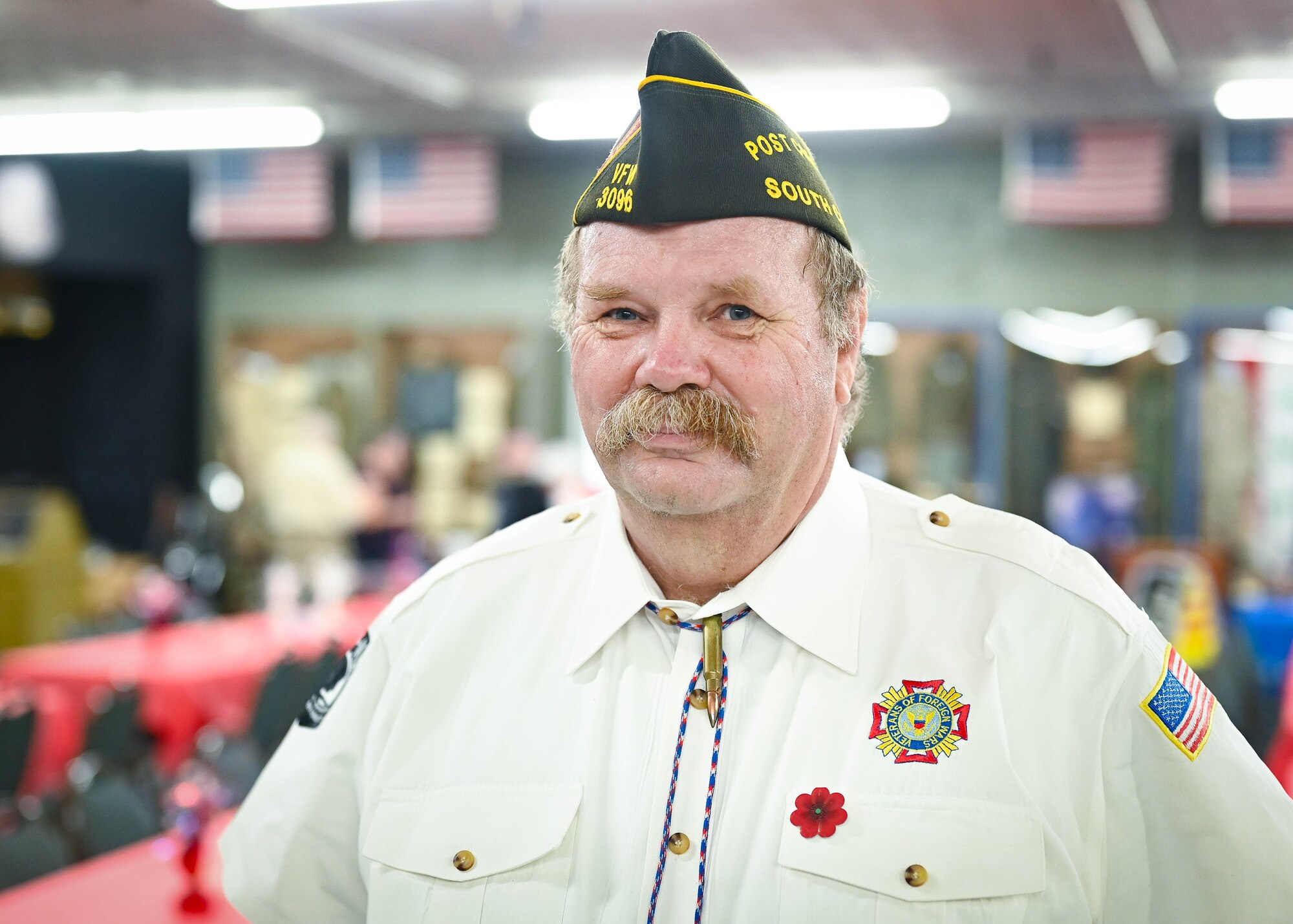 A man smiles for a photo.