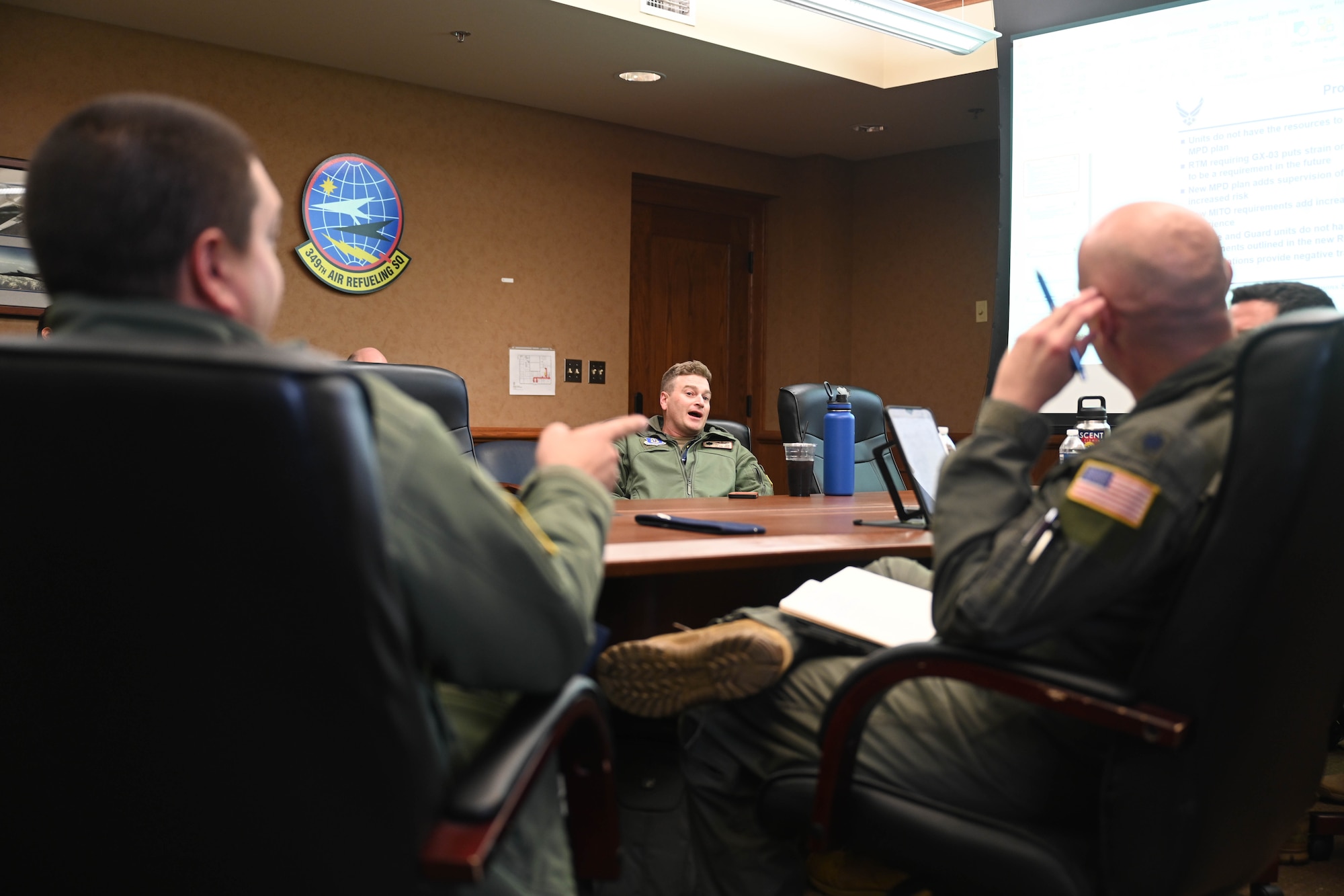 Attendees of the KC-46 Weapons Systems Council discuss the future of the KC-46A Pegasus Nov. 15, 2024, at McConnell Air Force Base, Kansas. The council focused on a variety of topics, including KC-46 training, insights from recent employment capability exercises and the latest tactical developments for the aircraft. (U.S. Air Force photo by Senior Airman William Lunn)