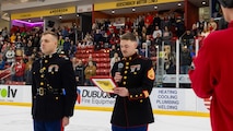 U.S. Marine Corps Staff Sgt. Chandler Swieckowski, a production recruiter with Recruiting Station Milwaukee, reads a citation, recognizing the newest members of the delayed-entry-program during the monthly pool function at Dubuque, Iowa, November 16, 2024. RSS Dubuque’s pool function consisted of conducting an oath of enlistment ceremony, recognizing the newest members of the DEP, and a traditional Marine Corps cake cutting ceremony. (U.S. Marine Corps photo by Sgt. Collette Hagen)
