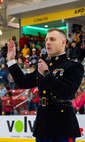 U.S. Marine Corps Capt. Jordan Olesen, an operations officer with Recruiting Station Milwaukee, delivers the oath of enlistment to the poolees of Recruiting Sub-Station Dubuque during a Dubuque Fighting Saints hockey game at Dubuque, Iowa, November 16, 2024. RSS Dubuque’s pool function consisted of conducting an oath of enlistment ceremony, recognizing the newest members of the delayed-entry-program, and a traditional Marine Corps cake cutting ceremony. (U.S. Marine Corps photo by Sgt. Collette Hagen