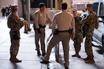 Soldiers from the 72nd Military Police company works with Las Vegas Metropolitan Police department at the Las Vegas Strip in Las Vegas, Nevada, Nov. 16, 2023. The 72nd MPs were at the Las Vegas Strip enhancing security for the Formula 1 Grand Prix. (U.S. Army National Guard Photo by Spc. Adrianne Lopez)(Photo was edited using tonal adjustments to enhance the subjects.)