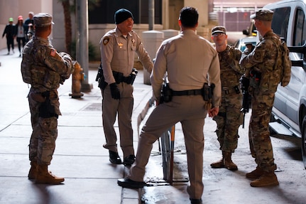 Soldiers from the 72nd Military Police company works with Las Vegas Metropolitan Police department at the Las Vegas Strip in Las Vegas, Nevada, Nov. 16, 2023. The 72nd MPs were at the Las Vegas Strip enhancing security for the Formula 1 Grand Prix. (U.S. Army National Guard Photo by Spc. Adrianne Lopez)(Photo was edited using tonal adjustments to enhance the subjects.)