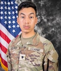 Portrait photo of U.S. Army Specialist Luciano Alcala wearing Army combat uniform in front of the U.S. flag