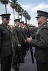 U.S. Marine Corps Lt. Col. Matthew Phelps, the commanding officer of 3rd Recruit Training Battalion, inspects a Pfc. Sayeed Montazeri with India Company, 3rd Recruit Training Battalion, during a Battalion Commander Inspection at Marine Corps Recruit Depot San Diego, California, Oct. 23, 2024. The Battalion commander’s inspection surveys new Marines’ knowledge, bearing, and attention to detail as one of their last tests before graduating. (U.S. Marine Corps photo by Lance Cpl. Jacob B. Hutchinson)