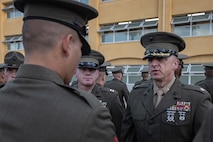 U.S. Marine Corps Lt. Col. Matthew Phelps, the commanding officer of 3rd Recruit Training Battalion, inspects a Pfc. Sayeed Montazeri with India Company, 3rd Recruit Training Battalion, during a Battalion Commander Inspection at Marine Corps Recruit Depot San Diego, California, Oct. 23, 2024. The Battalion commander’s inspection surveys new Marines’ knowledge, bearing, and attention to detail as one of their last tests before graduating. (U.S. Marine Corps photo by Lance Cpl. Jacob B. Hutchinson)
