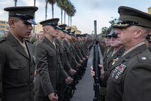 U.S. Marine Corps Lt. Col. Matthew Phelps, the commanding officer of 3rd Recruit Training Battalion, inspects a Pfc. Sayeed Montazeri with India Company, 3rd Recruit Training Battalion, during a Battalion Commander Inspection at Marine Corps Recruit Depot San Diego, California, Oct. 23, 2024. The Battalion commander’s inspection surveys new Marines’ knowledge, bearing, and attention to detail as one of their last tests before graduating. (U.S. Marine Corps photo by Lance Cpl. Jacob B. Hutchinson)
