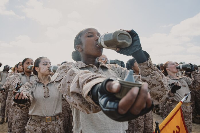 U.S. Marine Corps recruits with Lima Company, 3rd Recruit Training Battalion, hydrate prior to a Marine Corps Martial Arts Program class at Marine Corps Recruit Depot San Diego, California, Oct. 29, 2024. MCMAP aims to strengthen the mental and moral resiliency of recruits and Marines through realistic combative training, warrior ethos studies, and physical hardening. (U.S. Marine Corps photo by Cpl. Sarah M. Grawcock)