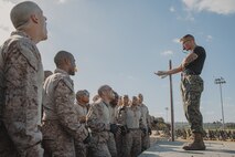 U.S. Marine Corps Martial Arts Instructor, Staff Sgt. Jacob Sinclair, with Support Battalion, Recruit Training Regiment, instructs recruits with Lima Company, 3rd Recruit Training Battalion, during a Marine Corps Martial Arts Program class at Marine Corps Recruit Depot San Diego, California, Oct. 29, 2024. MCMAP aims to strengthen the mental and moral resiliency of recruits and Marines through realistic combative training, warrior ethos studies, and physical hardening. (U.S. Marine Corps photo by Cpl. Sarah M. Grawcock)