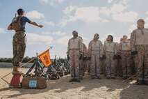 U.S. Marine Corps Sgt. Madison Polsinelli, a drill instructor with Lima Company, 3rd Recruit Training Battalion, instructs recruits before a Marine Corps Martial Arts Program class at Marine Corps Recruit Depot San Diego, California, Oct. 29, 2024. MCMAP aims to strengthen the mental and moral resiliency of recruits and Marines through realistic combative training, warrior ethos studies, and physical hardening. (U.S. Marine Corps photo by Cpl. Sarah M. Grawcock)