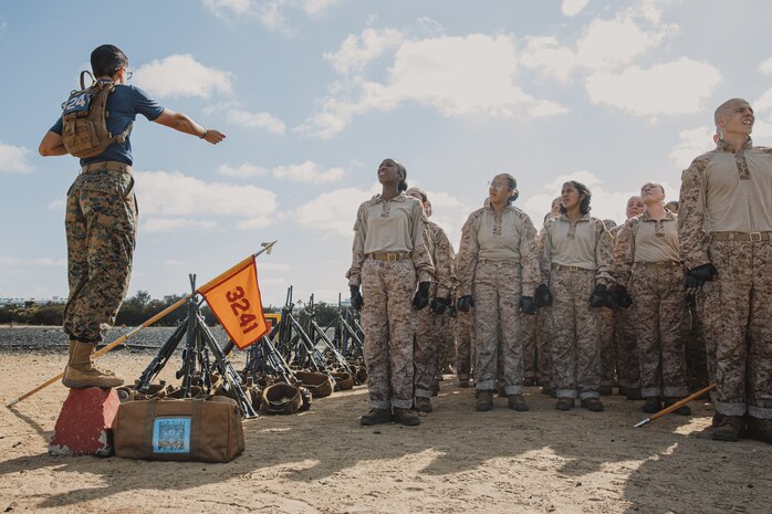 U.S. Marine Corps Sgt. Madison Polsinelli, a drill instructor with Lima Company, 3rd Recruit Training Battalion, instructs recruits before a Marine Corps Martial Arts Program class at Marine Corps Recruit Depot San Diego, California, Oct. 29, 2024. MCMAP aims to strengthen the mental and moral resiliency of recruits and Marines through realistic combative training, warrior ethos studies, and physical hardening. (U.S. Marine Corps photo by Cpl. Sarah M. Grawcock)