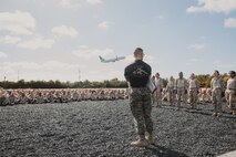 U.S. Marine Corps Martial Arts Instructor, Staff Sgt. Jacob Sinclair, with Support Battalion, Recruit Training Regiment, instructs recruits with Lima Company, 3rd Recruit Training Battalion, on how to properly conduct dynamic warm-ups before a Marine Corps Martial Arts Program class at Marine Corps Recruit Depot San Diego, California, Oct. 29, 2024. MCMAP aims to strengthen the mental and moral resiliency of recruits and Marines through realistic combative training, warrior ethos studies, and physical hardening. (U.S. Marine Corps photo by Cpl. Sarah M. Grawcock)