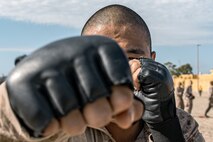U.S. Marine Corps recruit Kait Deeming with Fox Company, 2nd Recruit Training Battalion, participates in a body sparring event at Marine Corps Recruit Depot San Diego, California, Oct. 28, 2024. Recruits are taught Marine Corps Martial Arts Program techniques that instill basic self-defense that they will execute throughout recruit training during events like body sparring and pugil sticks to help build a warrior ethos and esprit de corps. (U.S. Marine Corps photo by Cpl. Sarah M. Grawcock)