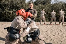 U.S. Marine Corps Martial Arts Instructor, Staff Sgt. Matthew Herman, with Support Battalion, Recruit Training Regiment, observes recruits with Fox Company, 2nd Recruit Training Battalion, during a body sparring event at Marine Corps Recruit Depot San Diego, California, Oct. 28, 2024. Recruits are taught Marine Corps Martial Arts Program techniques that instill basic self-defense that they will execute throughout recruit training during events like body sparring and pugil sticks to help build a warrior ethos and esprit de corps. (U.S. Marine Corps photo by Cpl. Sarah M. Grawcock)