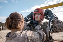 U.S. Marine Corps recruit Alexis Dye with Fox Company, 2nd Recruit Training Battalion, prepares for a body sparring event at Marine Corps Recruit Depot San Diego, California, Oct. 28, 2024. Recruits are taught Marine Corps Martial Arts Program techniques that instill basic self-defense that they will execute throughout recruit training during events like body sparring and pugil sticks to help build a warrior ethos and esprit de corps. (U.S. Marine Corps photo by Cpl. Sarah M. Grawcock)
