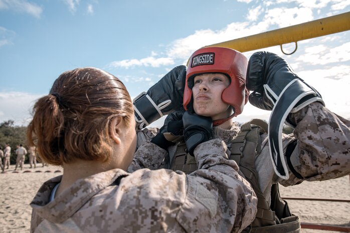 U.S. Marine Corps recruit Alexis Dye with Fox Company, 2nd Recruit Training Battalion, prepares for a body sparring event at Marine Corps Recruit Depot San Diego, California, Oct. 28, 2024. Recruits are taught Marine Corps Martial Arts Program techniques that instill basic self-defense that they will execute throughout recruit training during events like body sparring and pugil sticks to help build a warrior ethos and esprit de corps. (U.S. Marine Corps photo by Cpl. Sarah M. Grawcock)
