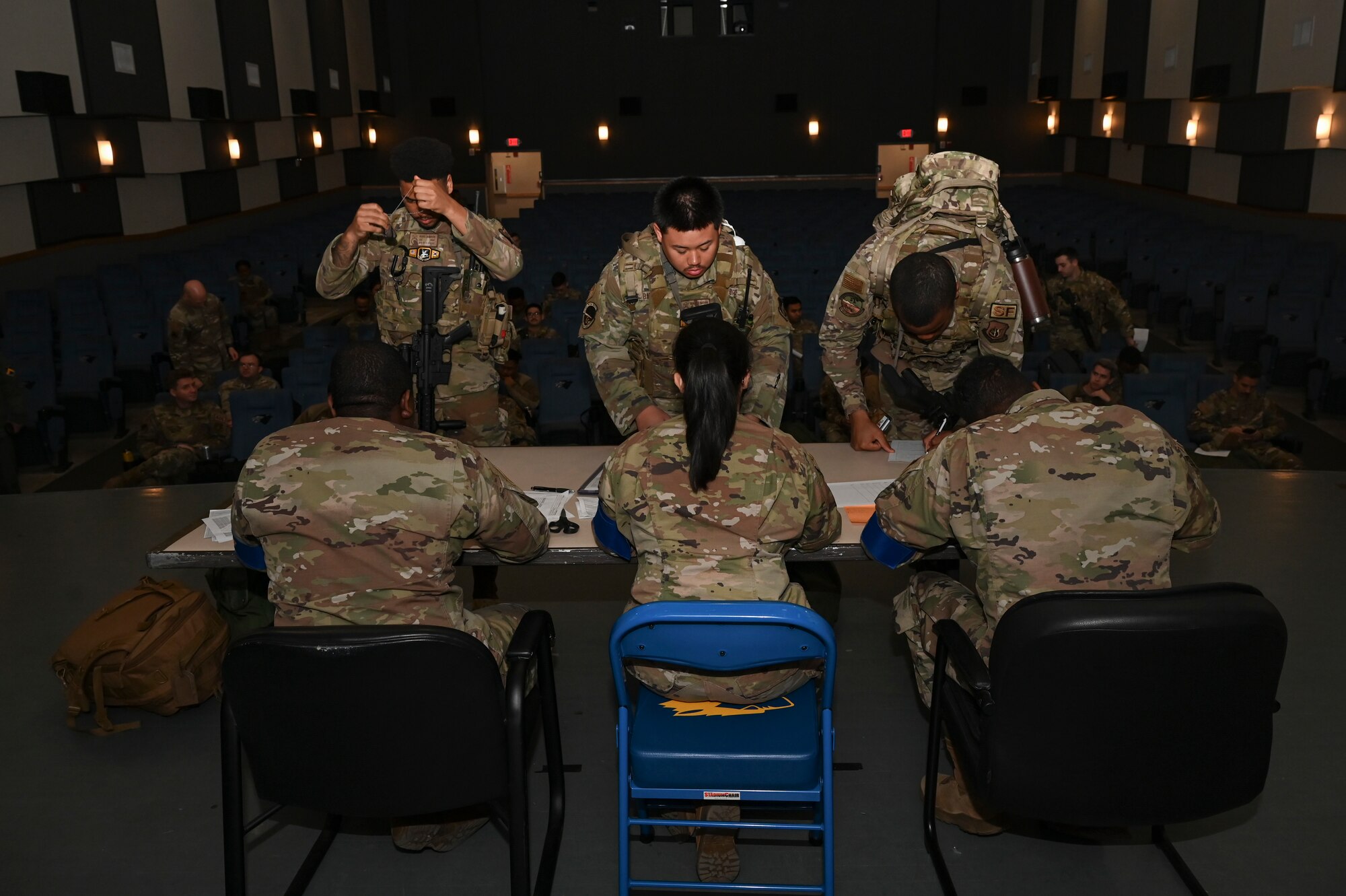 Airmen assigned to the 8th Fighter Wing conduct and process through a personnel deployment function line during Beverly Sentinel 25-1 at Kunsan Air Base, Republic of Korea