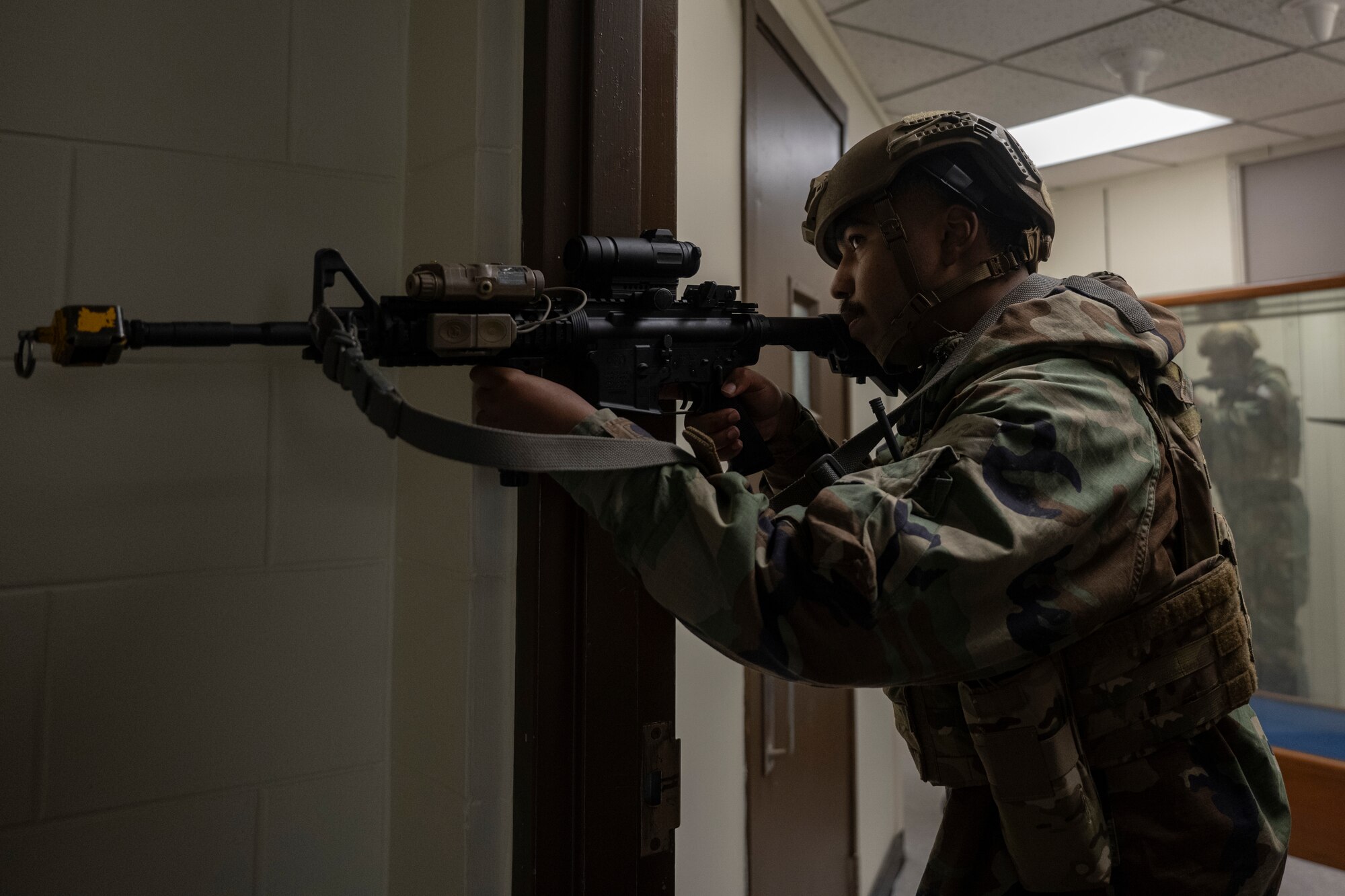 Airman Troy Irvin, 8th Security Forces Squadron entry controller, holds a firing position in a simulated ground attack during Beverly Sentinel 25-1 at Kunsan Air Base, Republic of Korea.