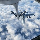 A 434th Air Refueling Wing KC-135R Stratotanker offloads fuel to an F-18 Super Hornet during Keen Sword 25.