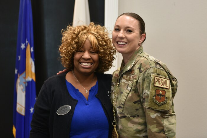 U.S. Air Force Chief Master Sgt. Select Jessica Thompson, 17th Force Support Squadron senior enlisted leader, and Jacquanna Whitfield, Child and Youth Services flight chief, stand for a photo during the Chief Release Party at the Powell Event Center, Goodfellow Air Force Base, Texas, Nov. 18, 2024. Whitfield congratulated Thompson on her selection for promotion. (U.S. Air Force photo by 1st Lt. Harris Hillstead)