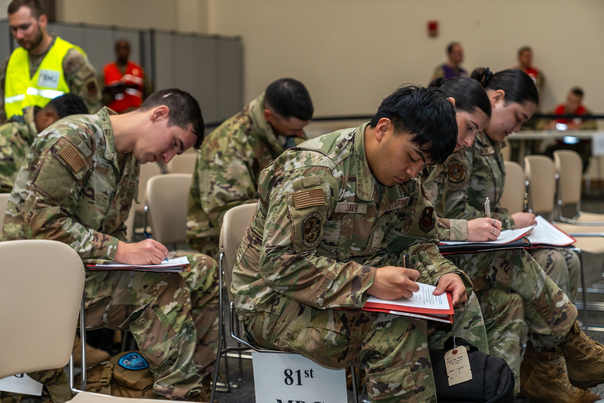 Airmen assigned to the 81st Training Wing fill out pre-deployment paperwork during the Combat Readiness Inspection at Keesler Air Force Base, Mississippi, Nov. 19, 2024.