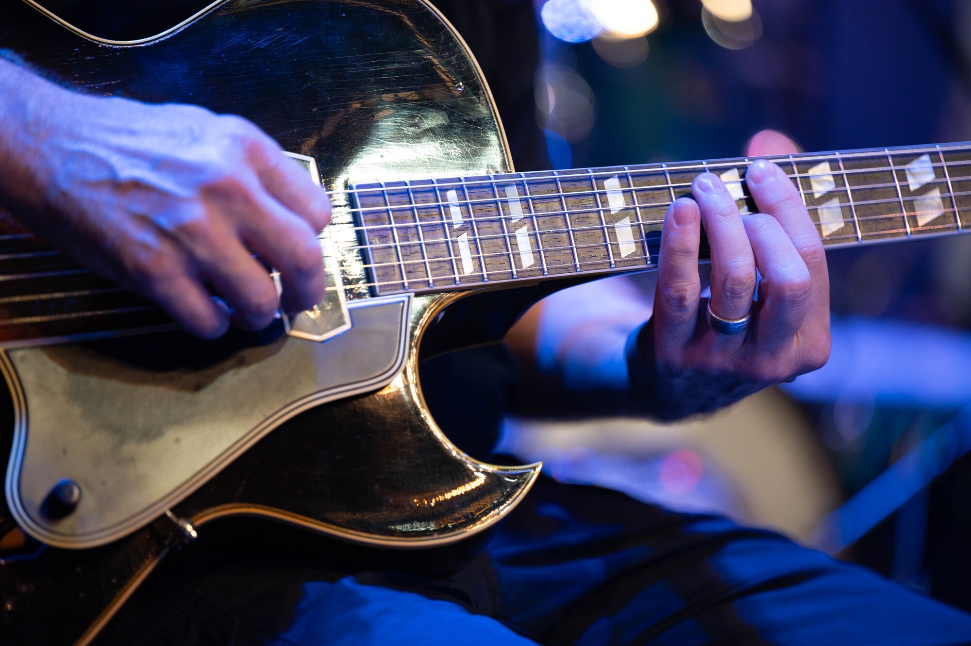 U.S. Air Force Senior Master Sgt. Geoff Reecer, guitarist with the USAF Band, plays the guitar during sound-check before a performance in the Airmen of Note Fall 2024 tour in Tampa, Fla., Nov. 11, 2024. The Airmen of Note’s mission, as a part of the U.S. Air Force Band, is to honor those who have served, inspire American citizens to heighten patriotism and service, and to connect the global community on behalf of the U.S. Air Force and the United States. The Airmen of Note consists of 17 active duty musicians and one vocalist stationed at Joint Base Anacostia-Bolling, Washington, D.C. (U.S. Air Force photo by Hayden Hallman)
