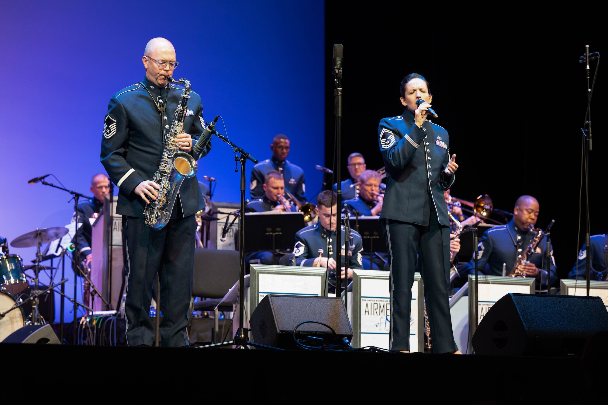 U.S. Air Force Master Sgt. Ted Baker, tenor saxophonist, and Senior Master Sgt. Emily Wellington, vocalist with the USAF Band, perform during an eventin the Airmen of Note Fall 2024 tour in Tampa, Fla., Nov. 11, 2024. The Airmen of Note’s mission, as a part of the U.S. Air Force Band, is to honor those who have served, inspire American citizens to heighten patriotism and service, and to connect the global community on behalf of the U.S. Air Force and the United States. The Airmen of Note consists of 17 active duty musicians and one vocalist stationed at Joint Base Anacostia-Bolling, Washington, D.C. (U.S. Air Force photo by Hayden Hallman)