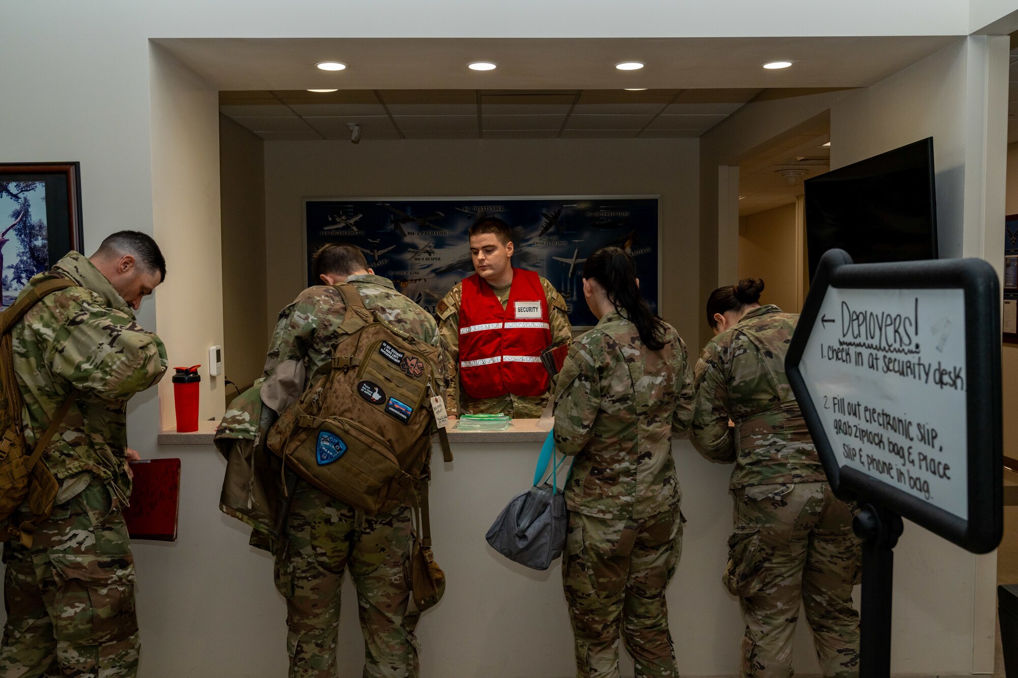 U.S. Air Force 2nd Lt. Paul James, 333rd Training Squadron student, checks in airmen assigned to the 81st Training Wing during the Combat Readiness Inspection at Keesler Air Force Base, Mississippi, Nov. 19, 2024.