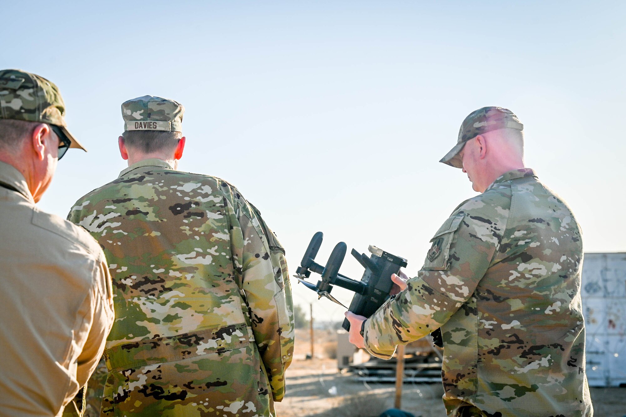 An Airman holds a counter-unmanned aircraft system (C-UAS).