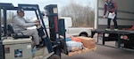 Workers unload a delivery of fresh fruits, vegetables and eggs to an ITO location. Many ITO’s are in remote locations where the nearest grocery stores are miles away.
(Photo Credit Mike Szklarski. DLA Troop Support – Subsistence)