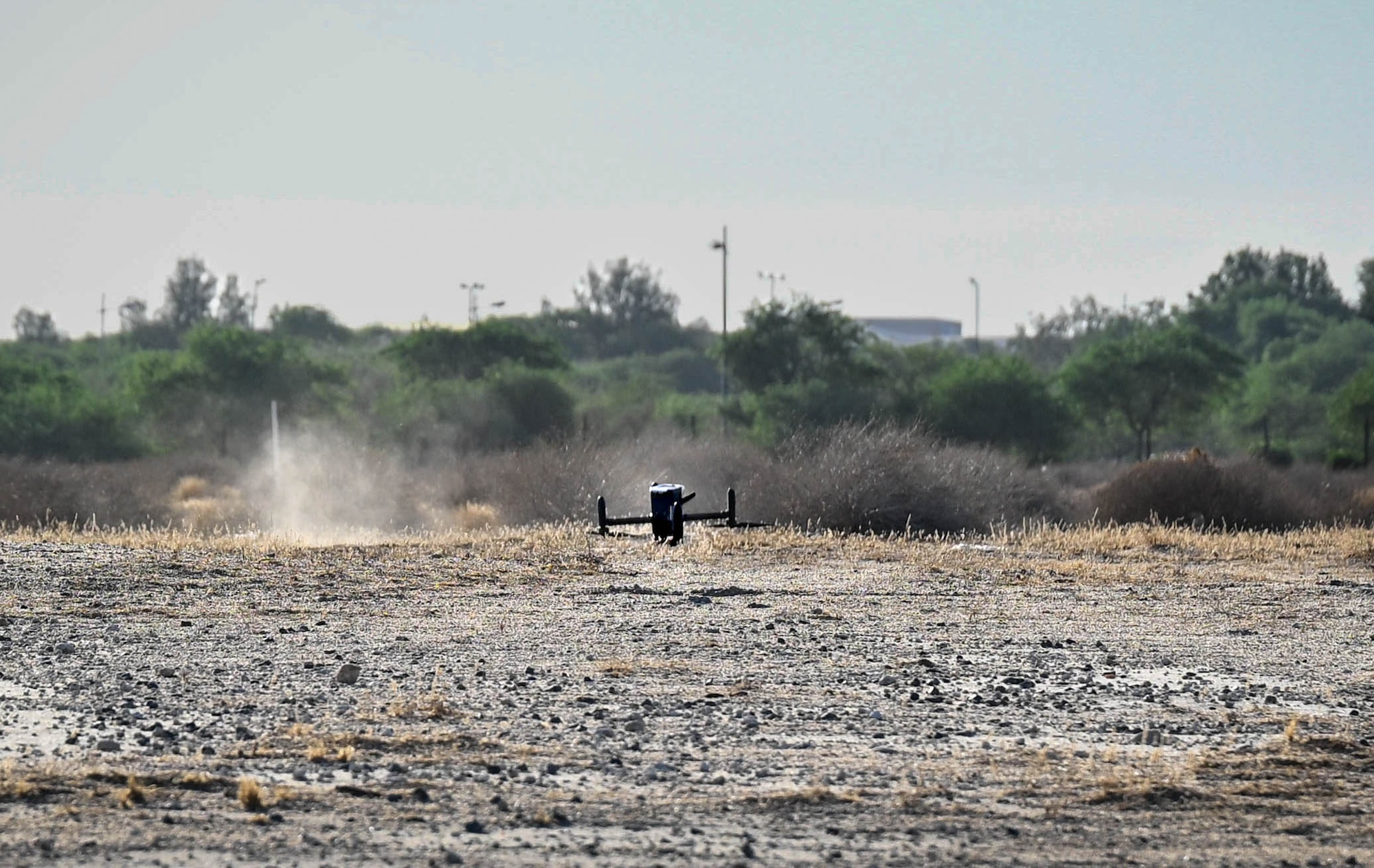 A counter-unmanned aircraft system (C-UAS) lands in a field.