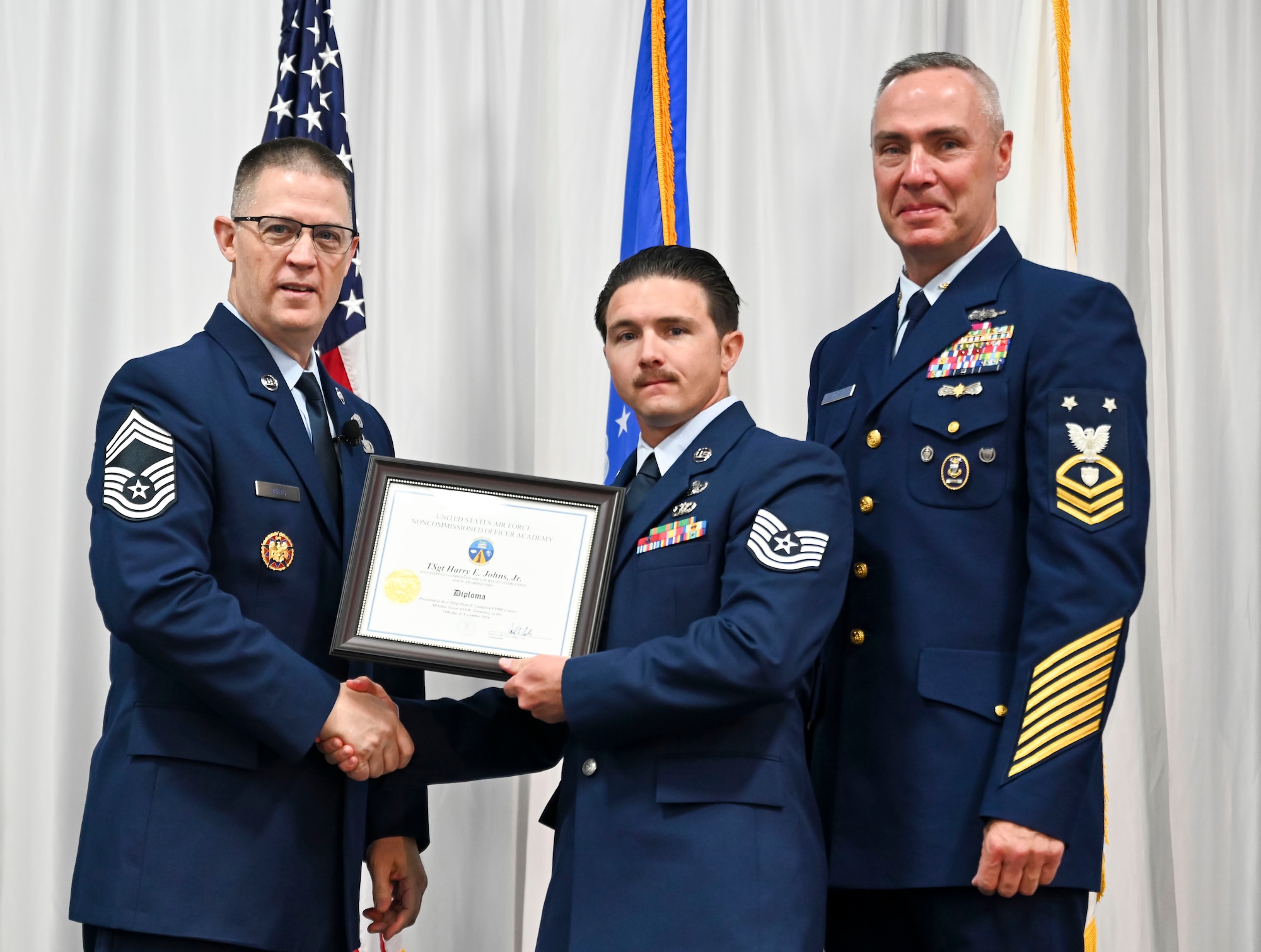 U.S. Air Force Technical Sgt. Harry Johns is recognized as a distinguished graduate during Non-Commissioned Officer Academy class 25-1 graduation, November 14, 2024, at the Training and Education Center (TEC), McGhee Tyson Air National Guard Base, Tennessee. The Lankford Enlisted Professional Military Education Center is one of three divisions of the TEC that accommodates 2,000 service members annually from the Total Force, Coast Guard, and partner nations. (Photo by Master Sgt. Regina Young)