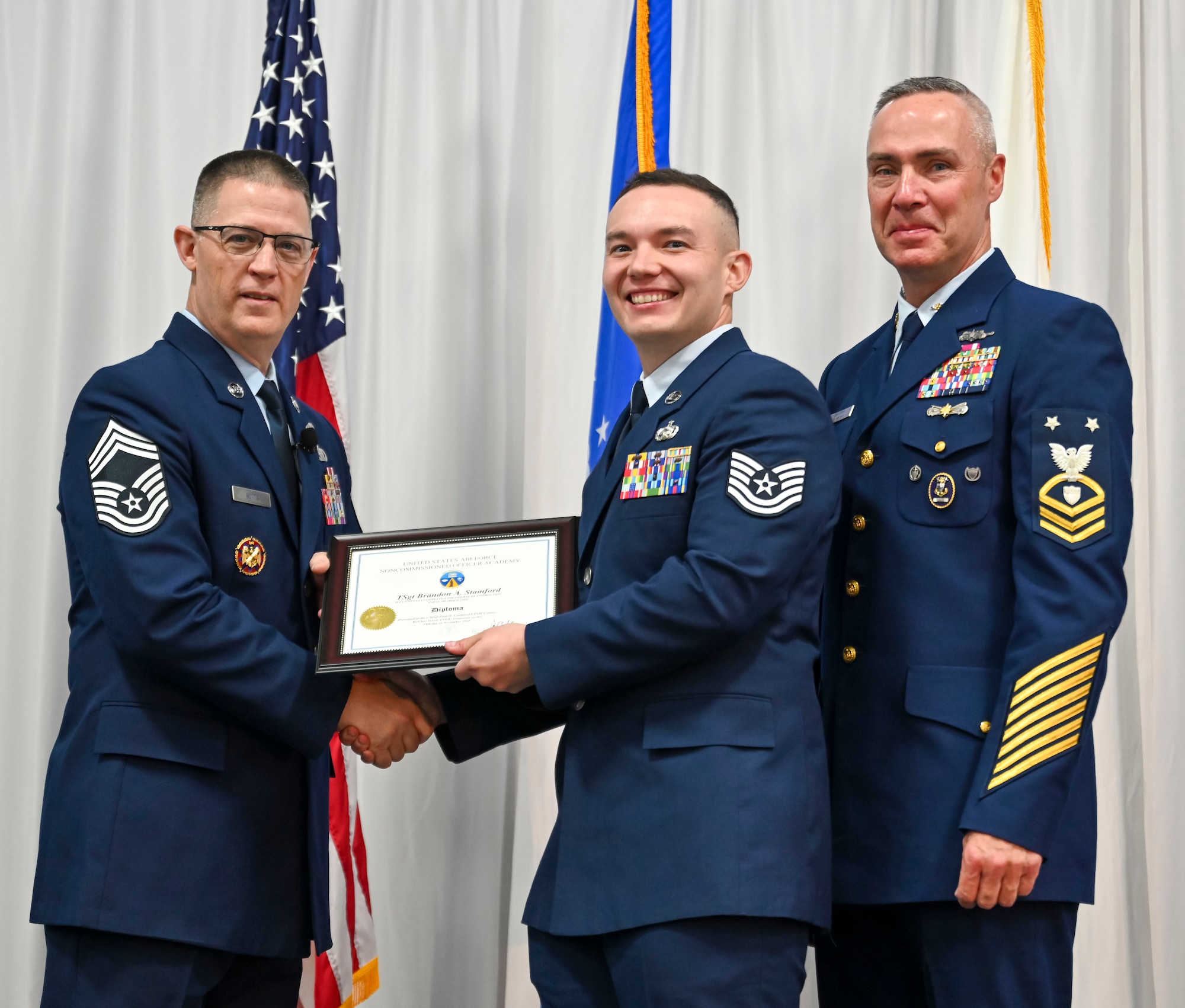 U.S. Air Force Technical Sgt. Brandon Stamford is recognized as a distinguished graduate during Non-Commissioned Officers Academy class 25-1 graduation, November 14, 2024, at the Training and Education Center (TEC), McGhee Tyson Air National Guard Base, Tennessee. The Lankford Enlisted Professional Military Education Center is one of three divisions of the TEC that accommodates 2,000 service members annually from the Total Force, Coast Guard, and partner nations. (Photo by Master Sgt. Regina Young)