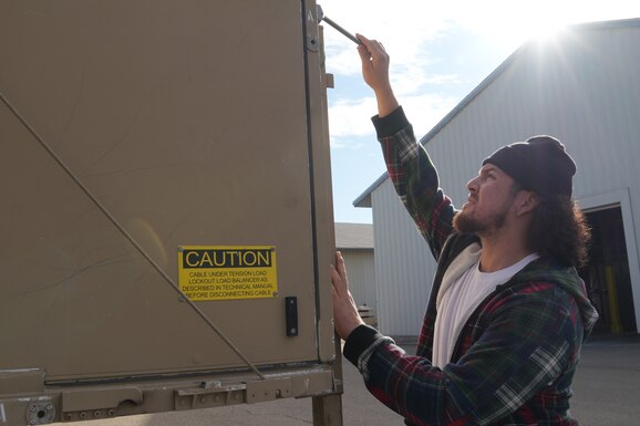 Employee at back of a trailer.