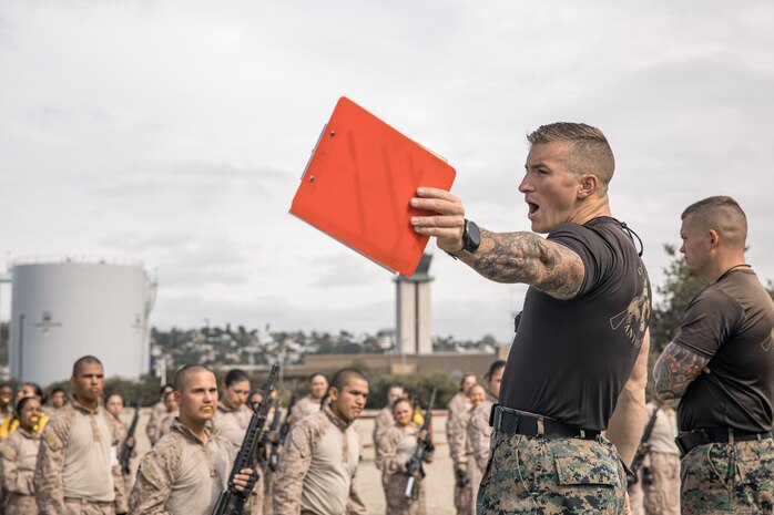 U.S. Marine Corps Martial Arts Instructor, Staff Sgt. Jacob Sinclair, with Support Battalion, Recruit Training Regiment, instructs recruits with Fox Company, 2nd Recruit Training Battalion, during a Marine Corps Martial Arts Program techniques class at Marine Corps Recruit Depot San Diego, California, Oct. 28, 2024. MCMAP aims to strengthen the mental and moral resiliency of individual recruits and Marines through realistic combative training, warrior ethos studies, and physical hardening. (U.S. Marine Corps photo by Cpl. Sarah M. Grawcock)
