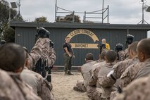 U.S. Marine Corps Martial Arts Instructor, Staff Sgt. Jacob Sinclair, with Support Battalion, Recruit Training Regiment, instructs recruits with Fox Company, 2nd Recruit Training Battalion, on how to properly execute Marine Corps Martial Arts Program techniques at Marine Corps Recruit Depot San Diego, California, Oct. 28, 2024. MCMAP aims to strengthen the mental and moral resiliency of individual recruits and Marines through realistic combative training, warrior ethos studies, and physical hardening. (U.S. Marine Corps photo by Cpl. Sarah M. Grawcock)