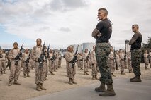 U.S. Marine Corps Staff Sgt. Jacob Sinclair, center, and Staff Sgt. Matthew Herman, right, both martial arts instructors with Support Battalion, Recruit Training Regiment, observe recruits with Fox Company, 2nd Recruit Training Battalion, during a Marine Corps Martial Arts Program techniques class at Marine Corps Recruit Depot San Diego, California, Oct. 28, 2024. MCMAP aims to strengthen the mental and moral resiliency of individual recruits and Marines through realistic combative training, warrior ethos studies, and physical hardening. (U.S. Marine Corps photo by Cpl. Sarah M. Grawcock)
