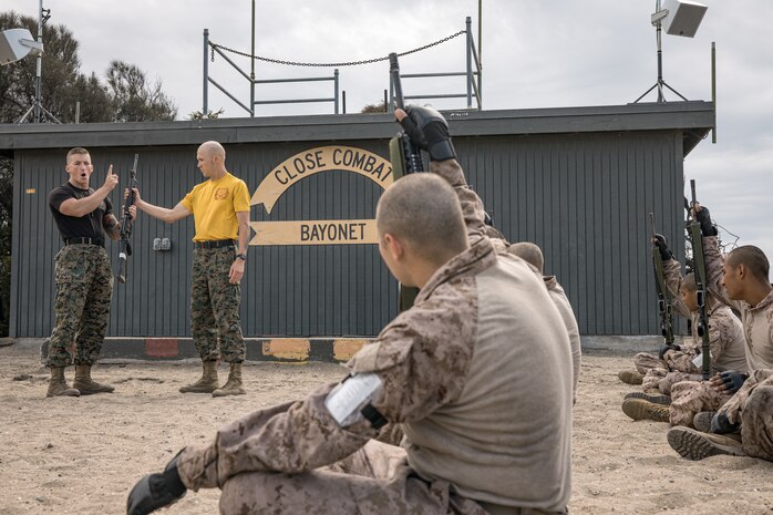 U.S. Marine Corps Martial Arts Instructor, Staff Sgt. Jacob Sinclair, with Support Battalion, Recruit Training Regiment, instructs recruits with Fox Company, 2nd Recruit Training Battalion, on how to properly execute Marine Corps Martial Arts Program techniques at Marine Corps Recruit Depot San Diego, California, Oct. 28, 2024. MCMAP aims to strengthen the mental and moral resiliency of individual recruits and Marines through realistic combative training, warrior ethos studies, and physical hardening. (U.S. Marine Corps photo by Cpl. Sarah M. Grawcock)