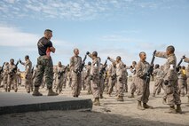 U.S. Marine Corps Martial Arts Instructor, Staff Sgt. Jacob Sinclair, with Support Battalion, Recruit Training Regiment, instructs recruits with Fox Company, 2nd Recruit Training Battalion, during a Marine Corps Martial Arts Program techniques class at Marine Corps Recruit Depot San Diego, California, Oct. 28, 2024. MCMAP aims to strengthen the mental and moral resiliency of individual recruits and Marines through realistic combative training, warrior ethos studies, and physical hardening. (U.S. Marine Corps photo by Cpl. Sarah M. Grawcock)