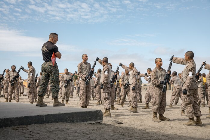 U.S. Marine Corps Martial Arts Instructor, Staff Sgt. Jacob Sinclair, with Support Battalion, Recruit Training Regiment, instructs recruits with Fox Company, 2nd Recruit Training Battalion, during a Marine Corps Martial Arts Program techniques class at Marine Corps Recruit Depot San Diego, California, Oct. 28, 2024. MCMAP aims to strengthen the mental and moral resiliency of individual recruits and Marines through realistic combative training, warrior ethos studies, and physical hardening. (U.S. Marine Corps photo by Cpl. Sarah M. Grawcock)