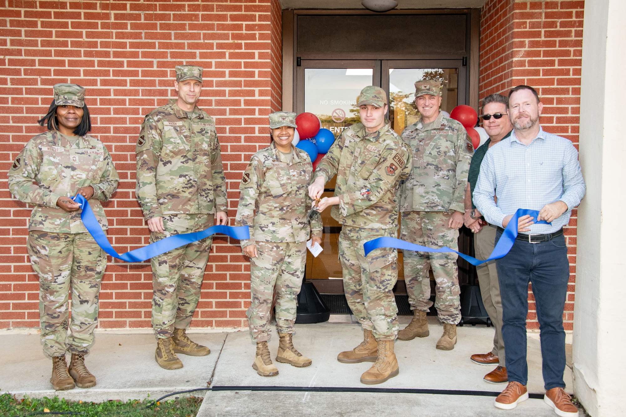 Leadership from the 42nd Air Base Wing cut the ribbon on the newly renovated dorms building at Maxwell Air Force Base, Ala., Nov. 20, 2024. Updates include new furniture, better LED lighting, a fire suppression system with sprinklers for added safety and luxury vinyl tile flooring.