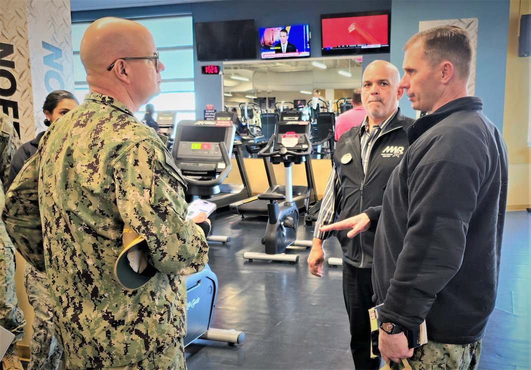 Commander, Navy Region Mid-Atlantic RADM Carl Lahti (left) is briefed on the John H. Chafee Fitness Center by Acting Morale, Welfare and Recreation Director Scott MacDonald (center) and Installation Executive Officer Cmdr. Jason Hinkley (Right) on November 20, 2024.