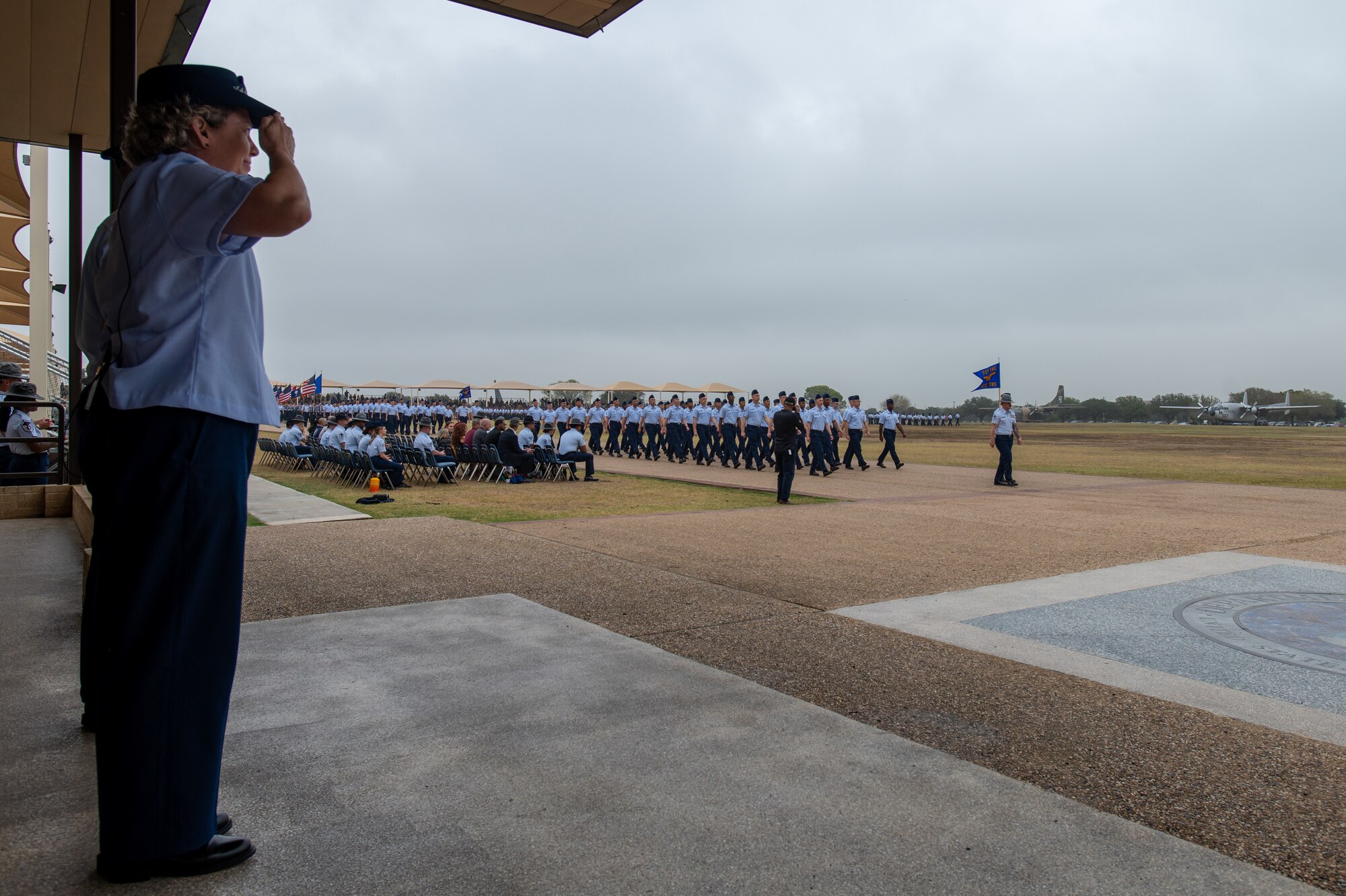 Brig. Gen. Amy Bumgarner, Air Force Office of Special Investigations commander, renders a salute during the Pass in Review at Basic Military Training (BMT) graduation ceremony Nov. 7, 2024, at Joint Base San Antonio-Lackland, Texas. This moment signifies the completion of training and official transition into active military service for these Airmen and Guardians. (U.S. Air Force photo by Thomas Brading)