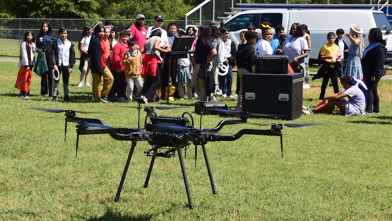 Nate Brock, civil engineer in the Civil Site and Survey Section, and Geotechnics Branch, demonstrates how a drone is used for surveys to Antioch Middle School students during a Tennessee STEAM Festival event Sept. 5, 2024, at the school in Antioch, Tennessee. The U.S. Army Corps of Engineers Nashville District recently selected him as its employee of the month for September 2024. (USACE Photo by Lee Roberts)