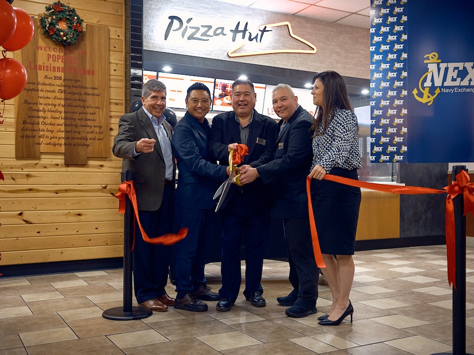 (From left to right) Rear Admiral (ret.) Robert J. Bianchi, Chief Executive Officer, Navy Exchange Service Command, joins Navy Exchange Yokosuka's Gaku Nakayama, John Shoda, Matthew Miller, and Charlene DuBose at a ribbon-cutting ceremony celebrating the grand opening of the Pizza Hut Express in the Main Street Food Court Monday, November 18.