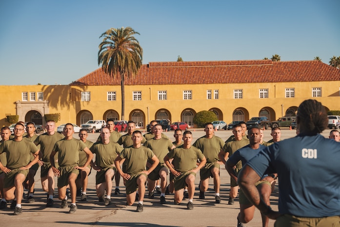 New U.S. Marines with Mike Company, 3rd Recruit Training Battalion, conduct dynamic warm-ups prior to the company motivational run at Marine Corps Recruit Depot San Diego, California, Nov. 14, 2024. The company motivational run is a three-mile cadence run conducted around the Depot and is the last physical training event the Marines will conduct before they graduate from MCRD San Diego. The event is also the first time friends and families will see their newly transformed Marines. (U.S. Marine Corps photo by Lance Cpl. Janell B. Alvarez)