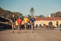 U.S. Marine Corps drill masters with Recruit Training Regiment, lead the company motivational run for Mike Company, 3rd Recruit Training Battalion, at Marine Corps Recruit Depot San Diego, California, Nov. 14, 2024. The company motivational run is a three-mile cadence run conducted around the Depot and is the last physical training event the Marines will conduct before they graduate from MCRD San Diego. The event is also the first time friends and families will see their newly transformed Marines. (U.S. Marine Corps photo by Lance Cpl. Janell B. Alvarez)