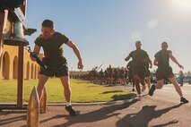 A new U.S. Marines with Mike Company, 3rd Recruit Training Battalion, ring 3rd Battalion liberty bell during the company motivational run at Marine Corps Recruit Depot San Diego, California, Nov. 14, 2024. The company motivational run is a three-mile cadence run conducted around the Depot and is the last physical training event the Marines will conduct before they graduate from MCRD San Diego. The event is also the first time friends and families will see their newly transformed Marines. (U.S. Marine Corps photo by Lance Cpl. Janell B. Alvarez)