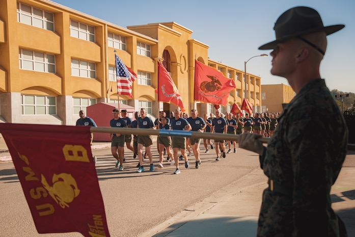 U.S. Marines with Recruit Training Regiment, lead the company motivational run for Mike Company, 3rd Recruit Training Battalion, at Marine Corps Recruit Depot San Diego, California, Nov. 14, 2024. The company motivational run is a three-mile cadence run conducted around the Depot and is the last physical training event the Marines will conduct before they graduate from MCRD San Diego. The event is also the first time friends and families will see their newly transformed Marines. (U.S. Marine Corps photo by Lance Cpl. Janell B. Alvarez)